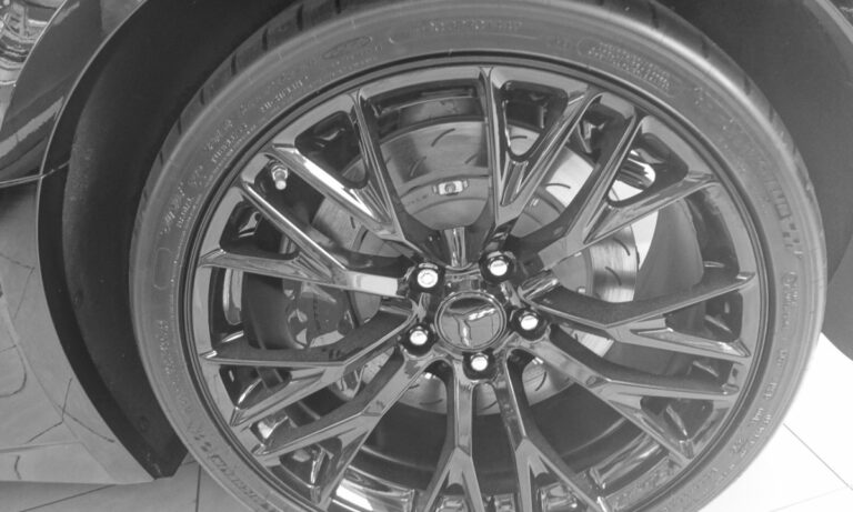 Close-up of a Chevrolet Corvette C7 alloy wheel with bowtie center cap